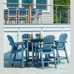 Outdoor bar height patio set with blue chairs and table on a deck.